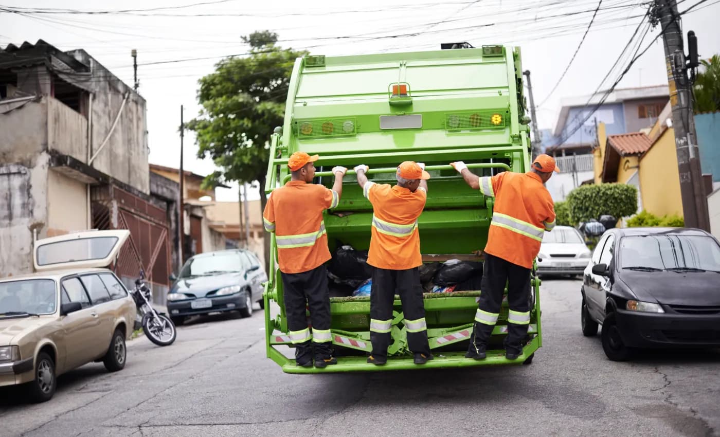 JunkJet crew loading a truck on a Dallas street