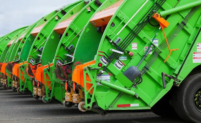 JunkJet crew member loading yard debris into a truck